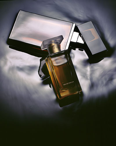 Oil poured over women's shoes – Photograph by George Ong