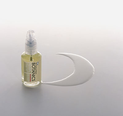Botanics bottle with cresent shaped puddle – Photograph by George Ong