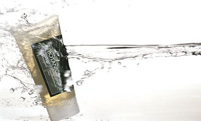 Botanics bottle sprayed with water – Photograph by George Ong