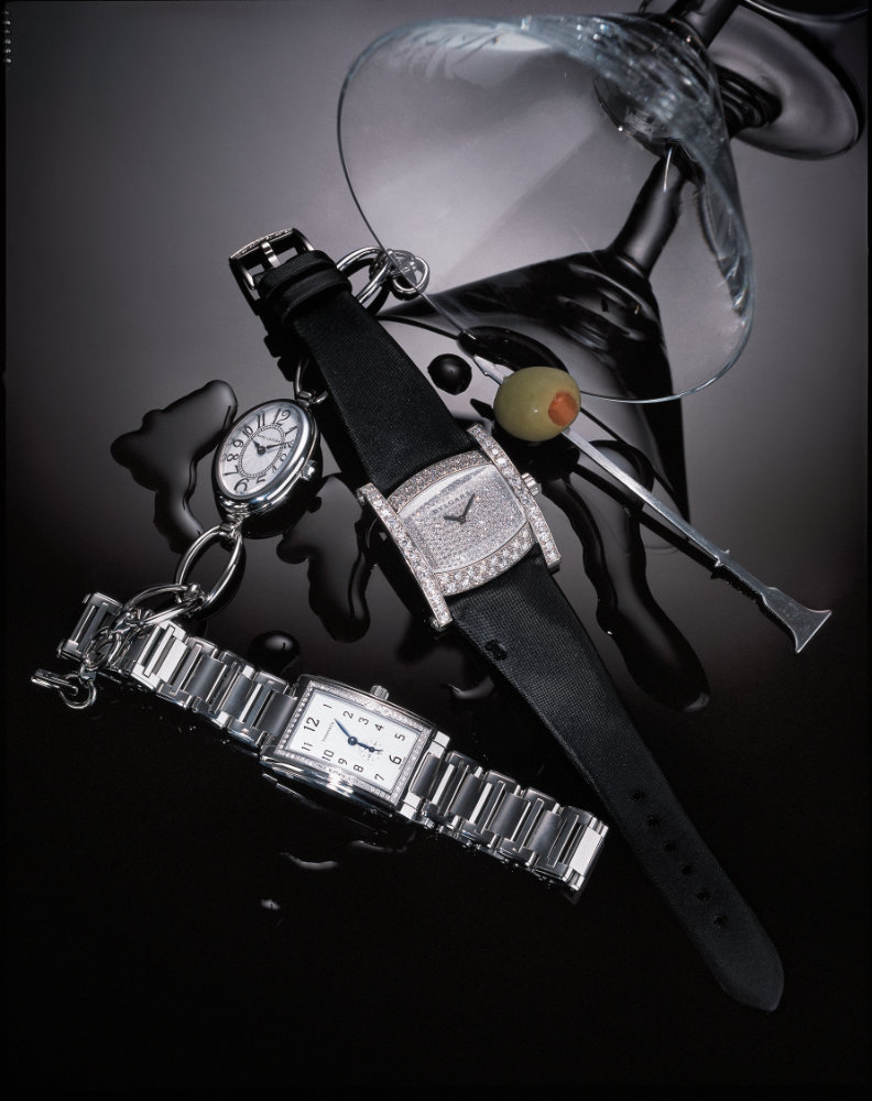 Watches, cocktail glass and olive – Photograph by George Ong