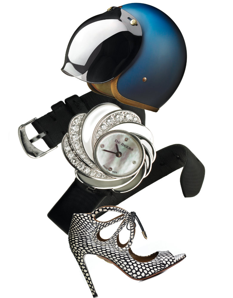 composition with crash helmet, black leather belt, diamond watch and high heeled shoe – Photograph by George Ong